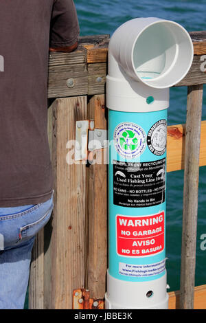 Monofilament recycling tube on fishing pier Stock Photo - Alamy