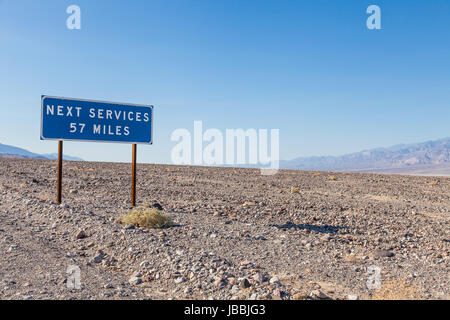 Death Valley, USA. Next service streetsight useful for travel concept Stock Photo