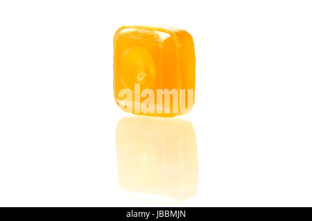 orange flavoured hard candy isolated on the white background Stock Photo