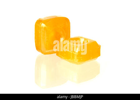 orange flavoured hard candy isolated on the white background Stock Photo