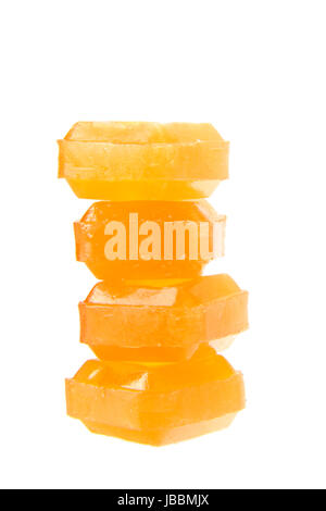 orange flavoured hard candy isolated on the white background Stock Photo