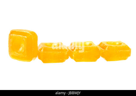 orange flavoured hard candy isolated on the white background Stock Photo