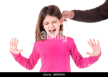 Young girl being punished with ear pulling Stock Photo