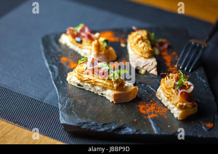 Mini sandwiches with pate in the restaurant. Restaurant food concept. Stock Photo