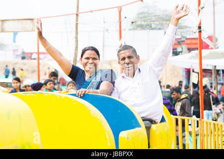 Happy 2 Indian Senior Couple Ride Jhula Fair In Suraj Kund Cheering Stock Photo