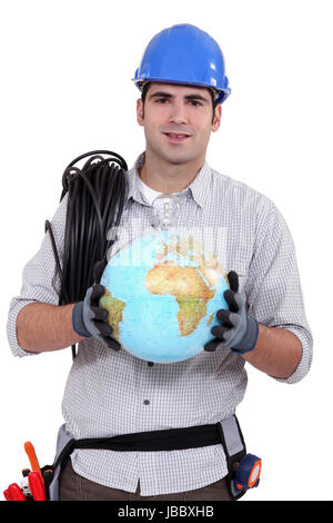 craftsman holding a globe Stock Photo
