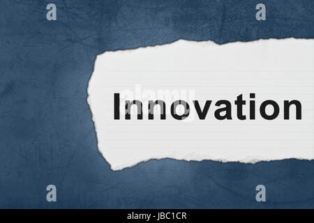 Innovation with white paper tears on blue texture Stock Photo