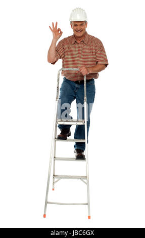 Contraction worker with excellent gesture climbing on ladder, full ...