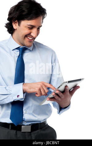 Young businessman operating tablet device Stock Photo