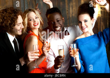 Group of friends enjoying drinks in restaurant bar Stock Photo