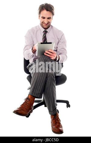 Smart business executive operating tablet pc Stock Photo