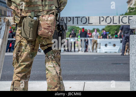 Harrisburg, Pennsylvania, USA. 10th June, 2017. About 50 members of ACT for America rallied on the steps of the Pennsylvania state capitol against Sharia law. ACT for America is the largest anti-Muslim group in the United States, according to the Southern Poverty Law Center. The rally was protected from a group of anarchists by members of the Three Percenters, many of whom carried firearms. Credit: Jim West/Alamy Live News Stock Photo