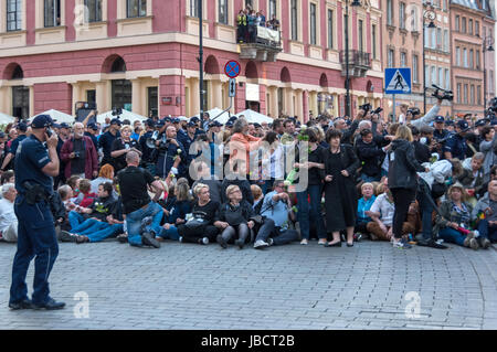 Warsaw, Poland - June 10th, 2017: Anti-government protesters block off a street in the Polish capital during the 86th monthly anniversary of the Smolensk crash in April, 2010. Stock Photo