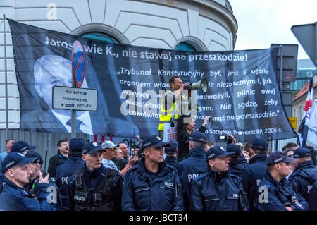 Warsaw, Poland - June 10th, 2017: Members of Polish security forces watch over as anti-government protesters block the Polish capital during the 86th monthly anniversary of the Smolensk crash in April, 2010. Stock Photo