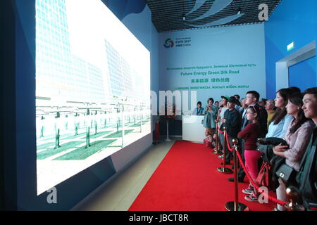 Astana, Kazakhstan. 10th June, 2017. People watch a short film about China Pavilion of the 2017 World Expo at 'the Preface' section in Astana, Kazakhstan, on June 10, 2017. The China Pavilion of the 2017 World Expo opened on Saturday in the Kazakh capital of Astana, which highlights China's achievements in developing, utilizing and protecting new energy. Credit: Lu Jinbo/Xinhua/Alamy Live News Stock Photo