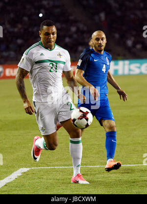 Baku, Azerbaijan. 10th June, 2017. Azerbaijan's Pavlo Pashayev(R) vies with Northern Ireland's Josh Magennis during the qualifying match for the European Championship between Azerbaijan and Northern Ireland in Baku, Azerbaijan, June 10, 2017. Northern Ireland won 1-0. Credit: Tofiq Babayev/Xinhua/Alamy Live News Stock Photo