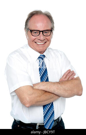Confident senior manager of a company. Facing camera with a smile. Stock Photo