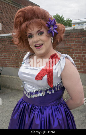 A man in drag with a red hair wig and a butterfly dress. At the 2024 ...