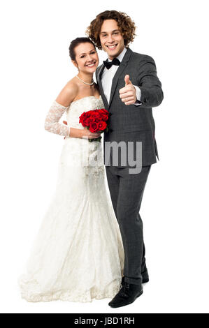 Full length portrait of a dashing young bridegroom gesturing success Stock Photo