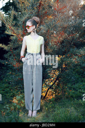 Glamor. Trendy Stylish Fashion Model in Elegant Pants Outdoors Stock Photo