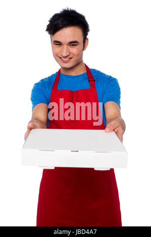 Young male chef delivering the order