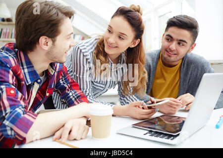 Clever students brainstorming and sharing ideas Stock Photo