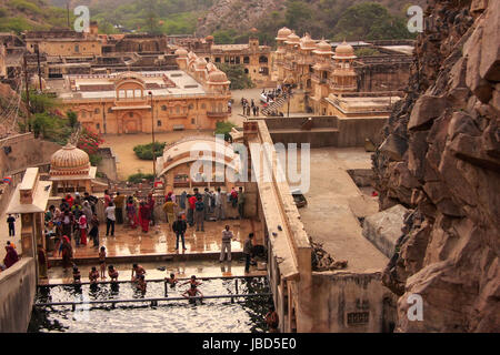 Galtaji Temple near Jaipur, Rajasthan, India. It consists of a series of temples built in to a narrow crevice in the ring of hills that surround Jaipu Stock Photo