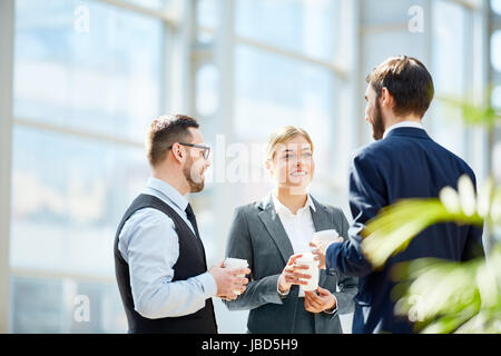 Business team having talk at coffee break Stock Photo