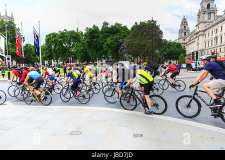 Large group of cyclists and cycling commuters in Parliament Square, Westminster, London Stock Photo