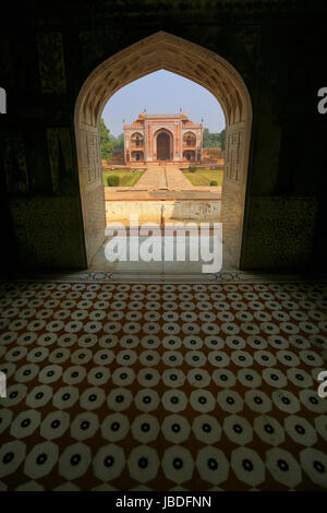 Entrance gate seen from interior of Itimad-ud-Daulah Mausoleum in Agra, Uttar Pradesh, India. This Tomb is often regarded as a draft of the Taj Mahal. Stock Photo