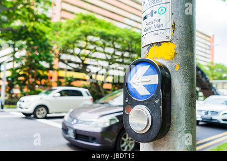 Button for traffic light and Cars in background. Traffic lights at the crossroads. Button of the mechanism lights traffic lights on the street. System Stock Photo