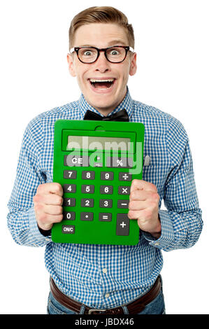 Happy young nerd showing big green calculator Stock Photo