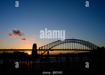 Iconic view of the Sydney Harbour Bridge at sunset, facing west from the Opera House steps. Stock Photo