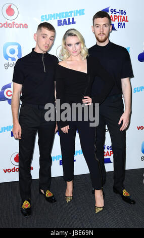 Clean Bandit's Grace Chatto (centre), Jack Patterson (right) and Luke Patterson (left) at Capital FM's Summertime Ball with Vodafone held at Wembley Stadium, London. Stock Photo