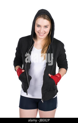 Freigestelltes Foto einer jungen lächelden Boxerin im Kapuzenpulli und mit bandagierten Händen Stock Photo