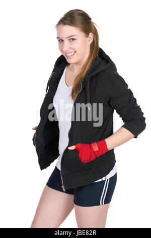Freigestelltes Foto einer jungen lächelden Boxerin im Kapuzenpulli und mit bandagierten Händen Stock Photo