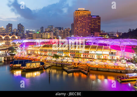 Colorful light building at night in Clarke Quay, Singapore. Clarke Quay, is a historical riverside quay in Singapore. Stock Photo