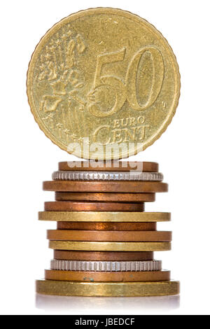 Vertically stacked coins, isolated on white background Stock Photo