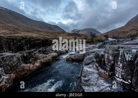 glen etive valley with its dark river flowing through it Stock Photo