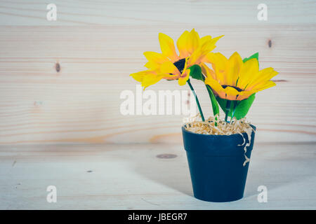 Sunflower in a Flowerpot On a wooden background Stock Photo