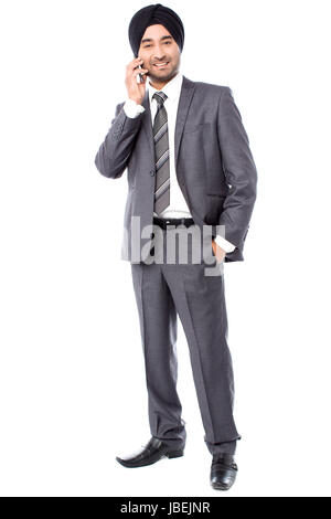 Handsome young businessman on call over white Stock Photo