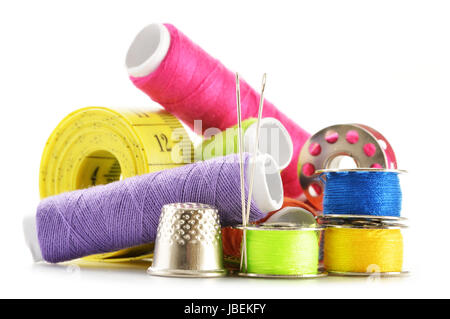 Composition with tailor needles and threads over white background Stock Photo