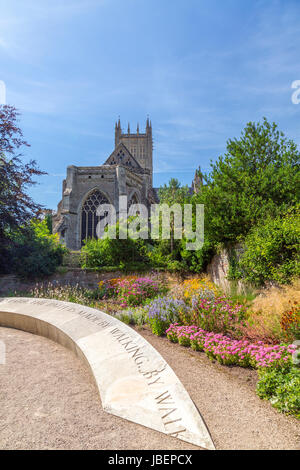 A colourful herbaceous border in Bishop Peter's Garden in a corner of the Bishop's Palace grounds in Wells, Somerset, England, UK Stock Photo