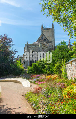 A colourful herbaceous border in Bishop Peter's Garden in a corner of the Bishop's Palace grounds in Wells, Somerset, England, UK Stock Photo