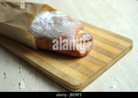 Whole pineapple pie on a cutting board at the kitchen Stock Photo
