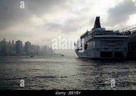 Hong Kong dusk cruise ship seen from Kowloon Stock Photo