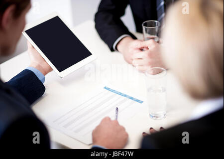 Team of business associates at work in office Stock Photo