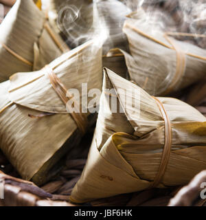 Asian Chinese rice dumplings on basket, fresh with hot steamed smoke Stock Photo