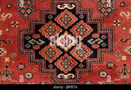 geometric  pattern old Persian carpet closeup Stock Photo