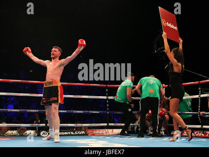 James Tennyson (left) celebrates after defeating Ryan Doyle during their WBA International Super-Featherweight Championship at Odyssey Arena Belfast. Stock Photo